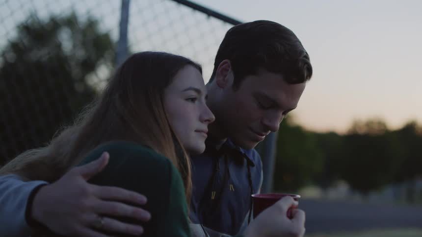 A young couple drinking coffee together in the morning