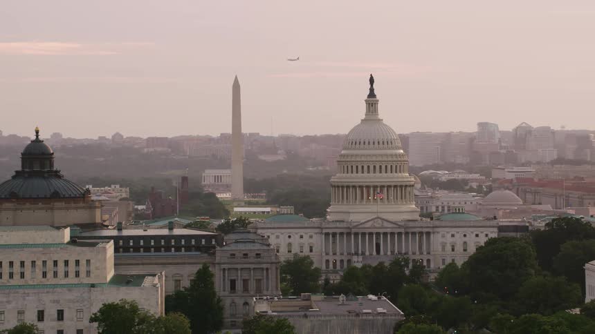 The us capitol building and washington monument standing above the dc skyline