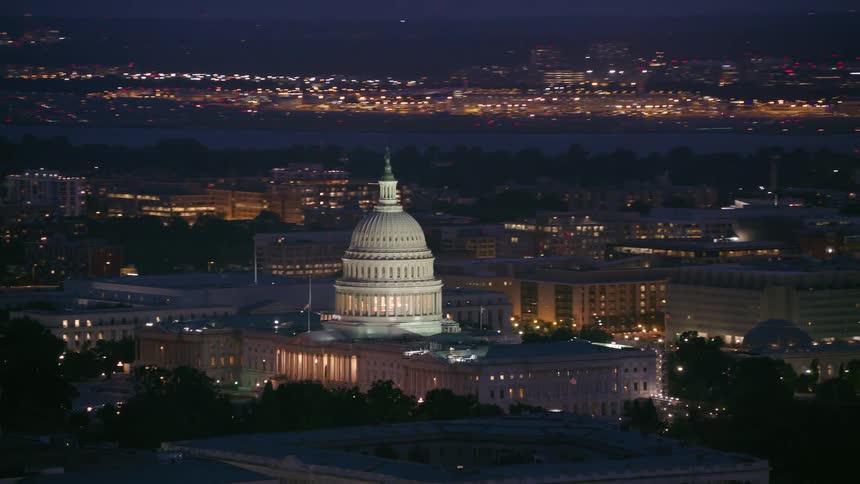 Aerial view of buildings in a downtown city at night