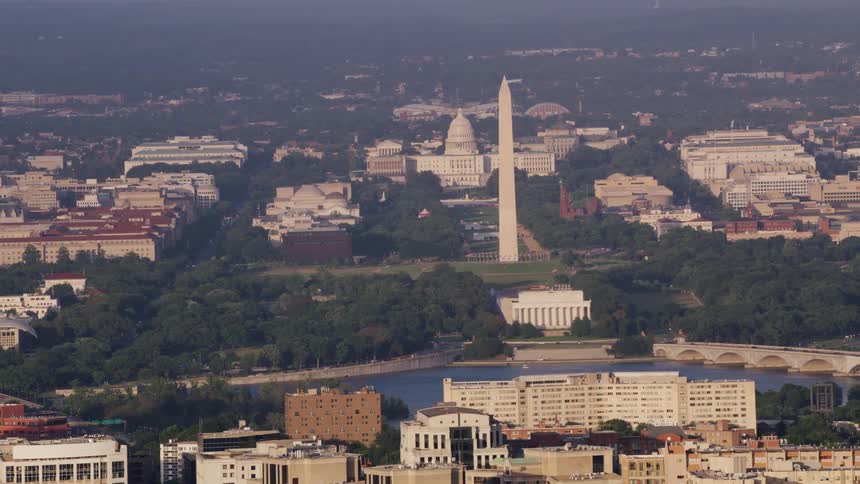 Aerial view of a city near a river is displayed in spring