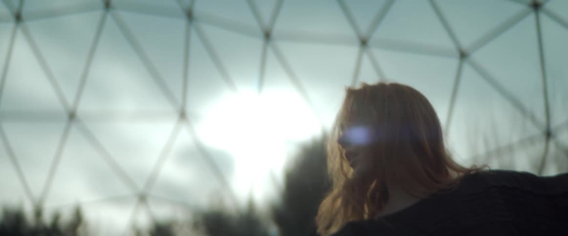 A view of a woman dancing outdoors