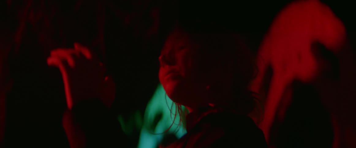A woman moves around at night