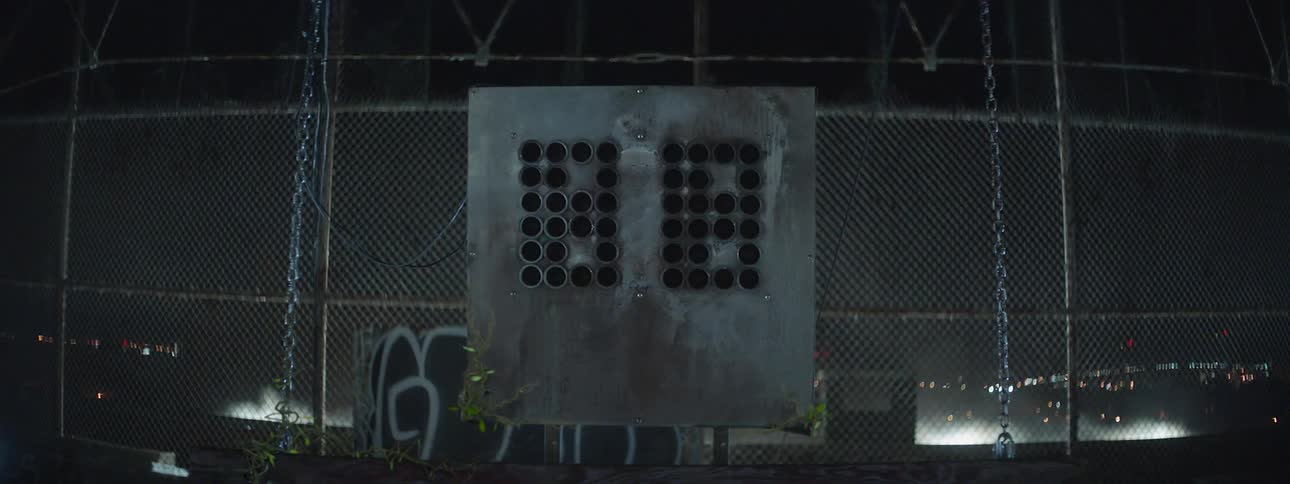A shot clock is counting at night