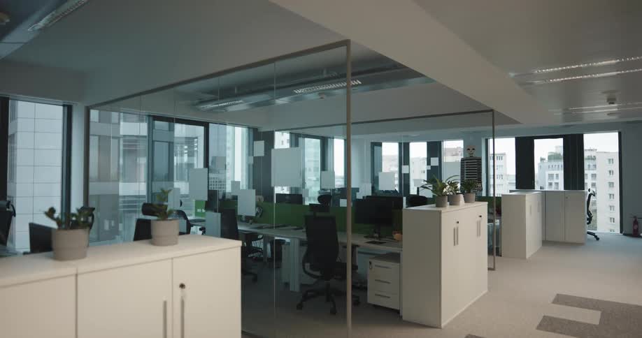 A view of an empty office building is displayed at midday