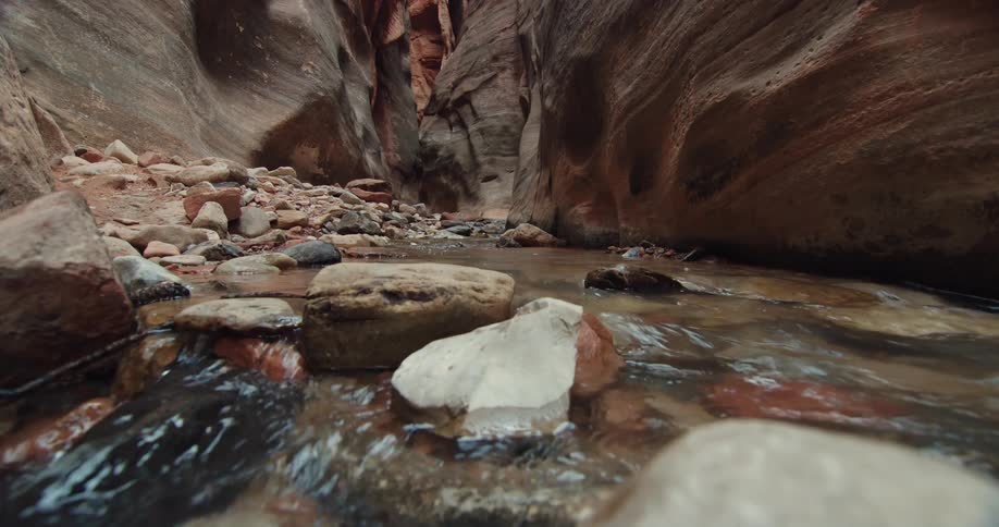 A stream runs through the canyon
