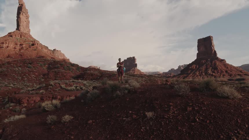 A man is standing in the desert