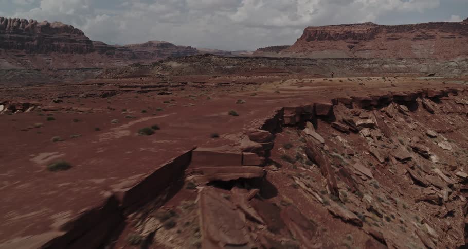 A man is hiking through a rock formation in spring