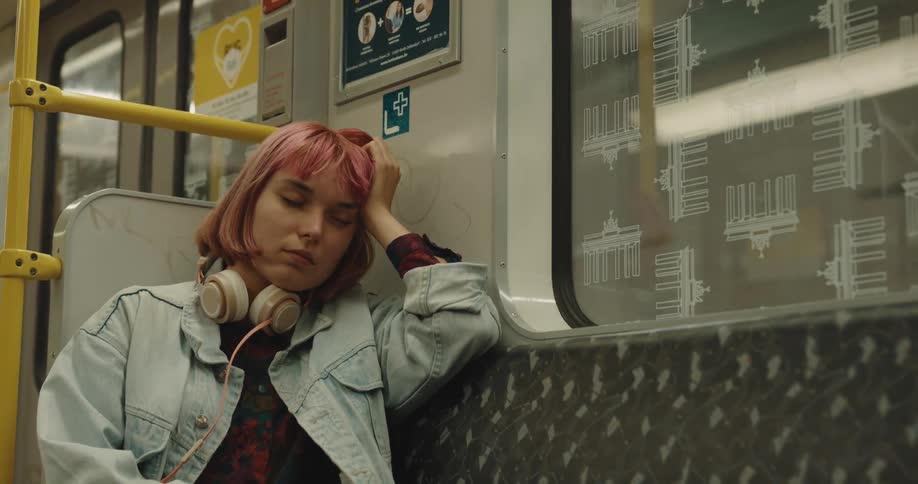A woman is riding the train
