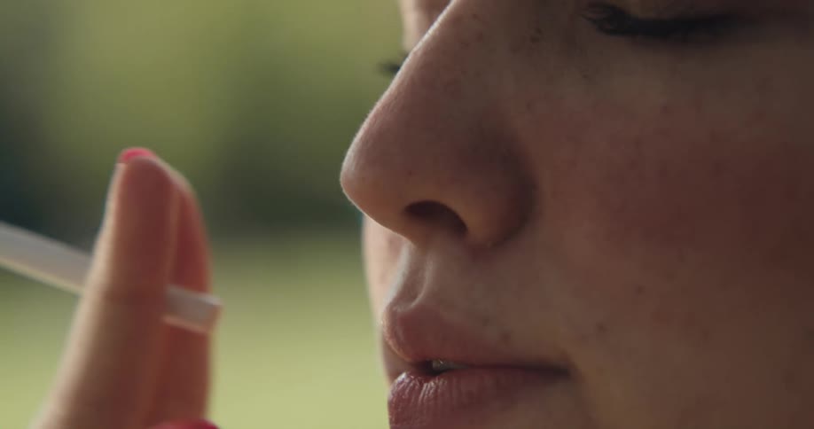 Close up of woman smoking a cigarette