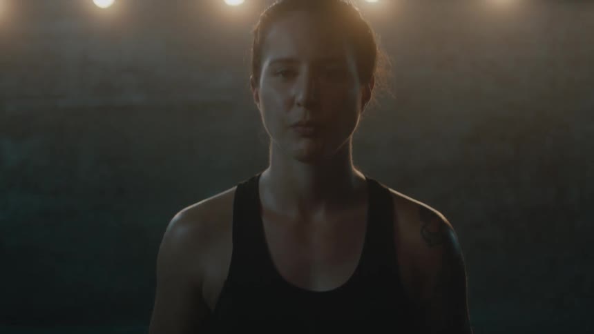 A portrait of a woman standing in a room
