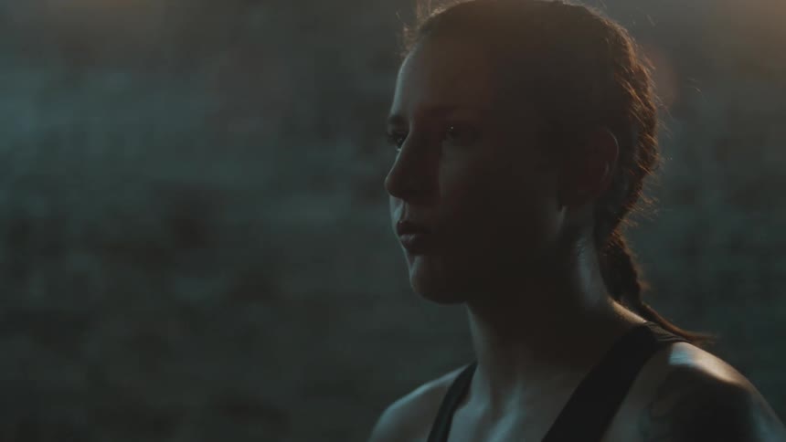 A woman is sweating and is looking at a distance