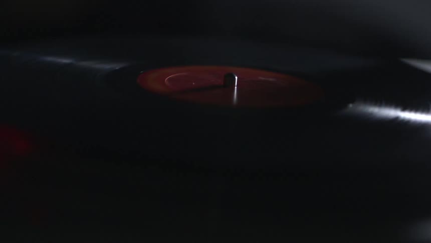 A record player is spinning a record