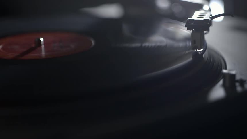 A record is spinning on a turn table