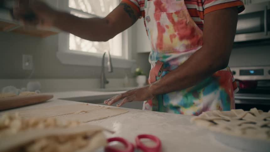 A man is preparing to cook a dessert in his kitchen