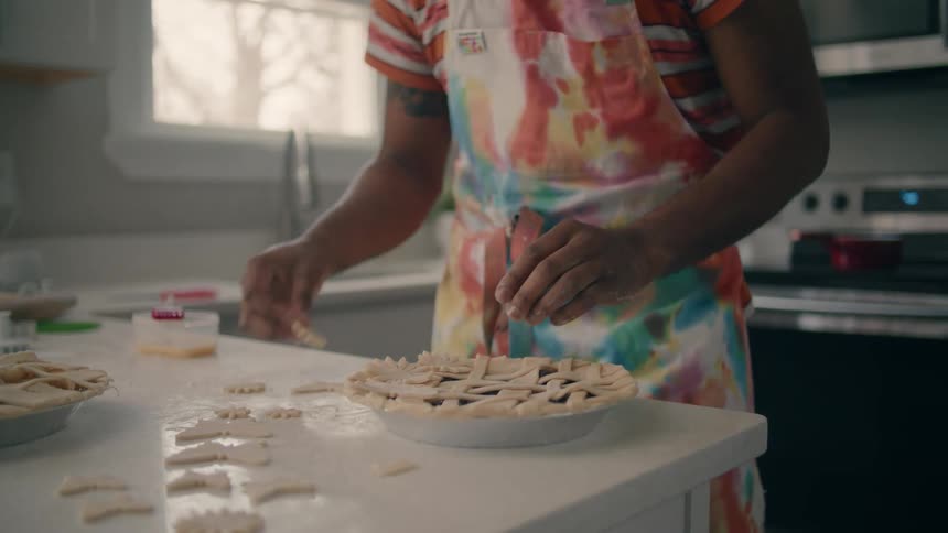 A man is baking a pie