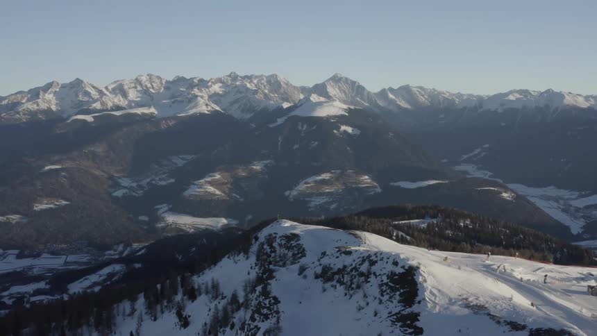 An aerial view of a snow covered mountain range