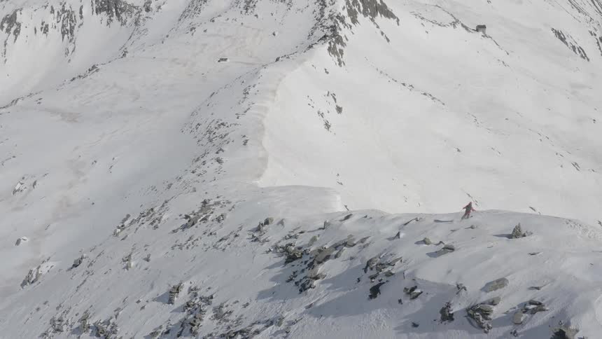 A person is skiing down the mountain