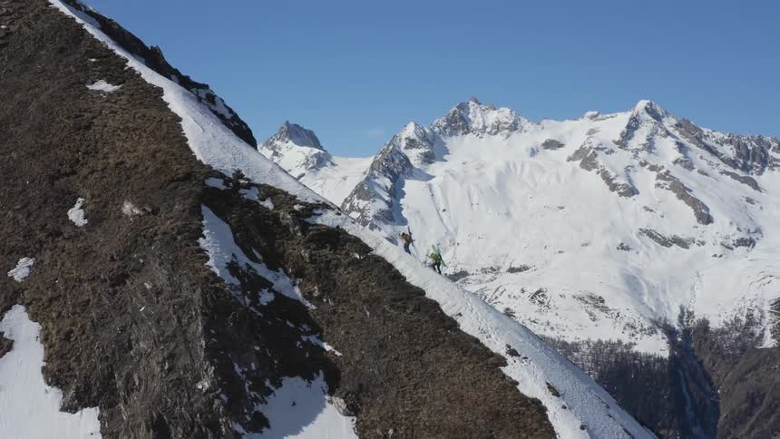 Two people climb the mountain together