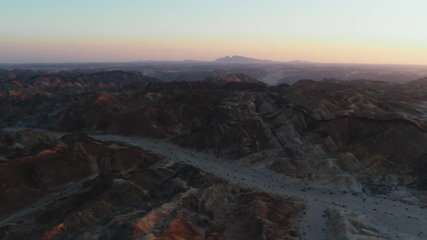Mountainous desert aerial at sunset