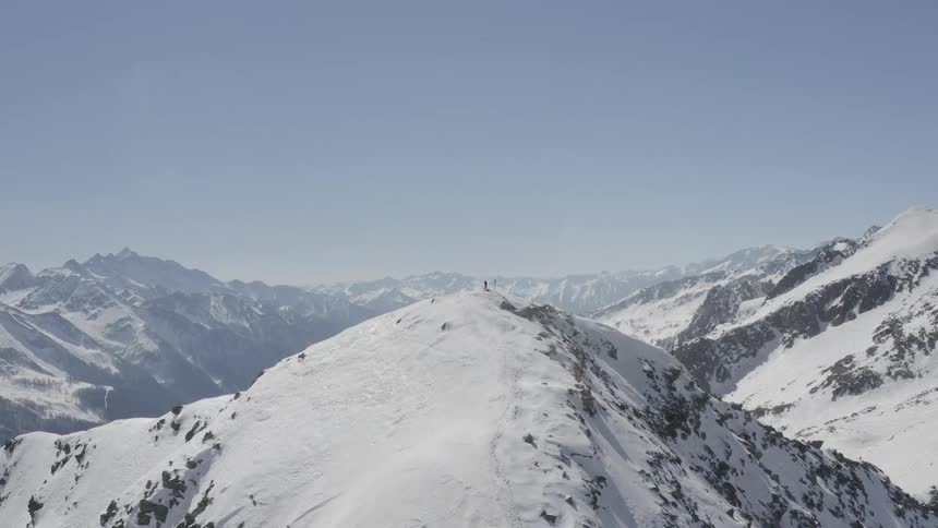 Snow covers tall mountain peaks