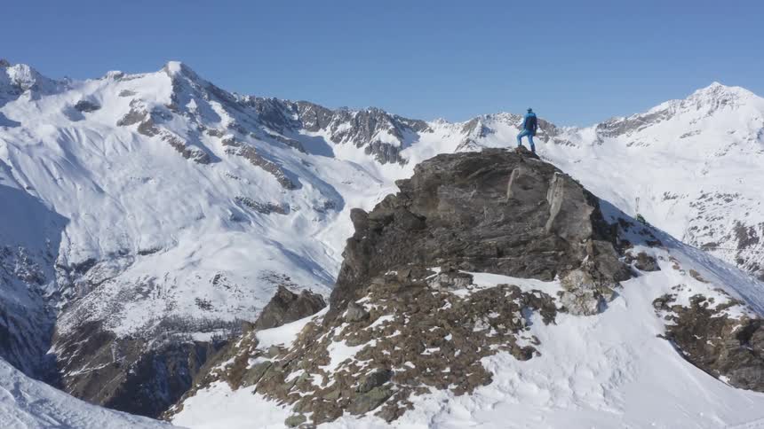 A man stands on the mountain top