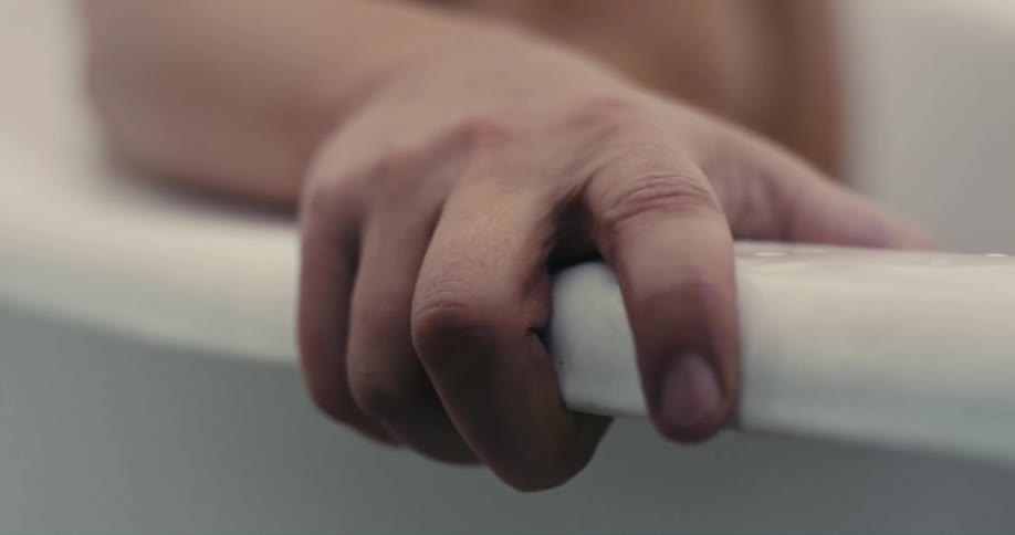 A man sitting in a bathtub