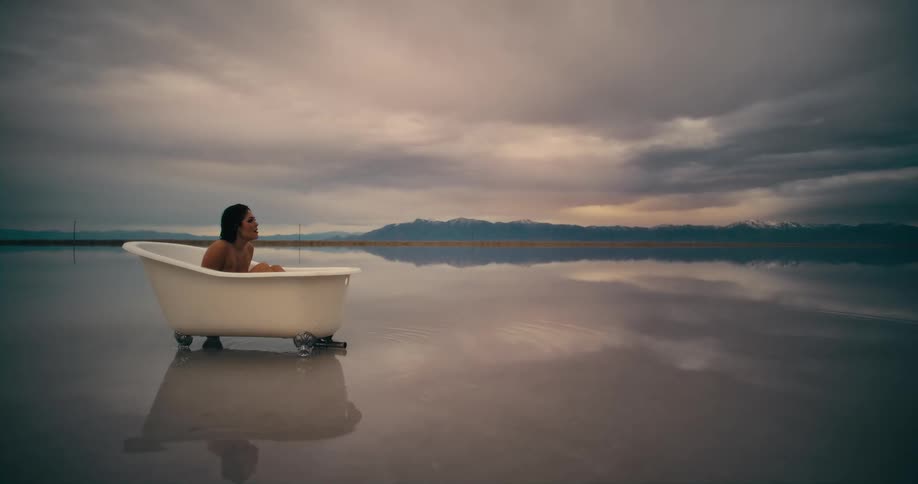 A woman sitting in a bathtub