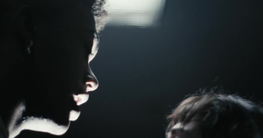A woman cowers in fear as her partner yells in her face