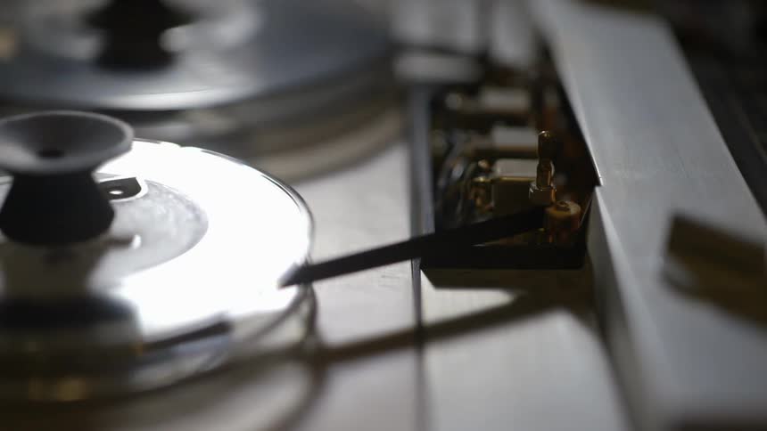A tape machine begins running