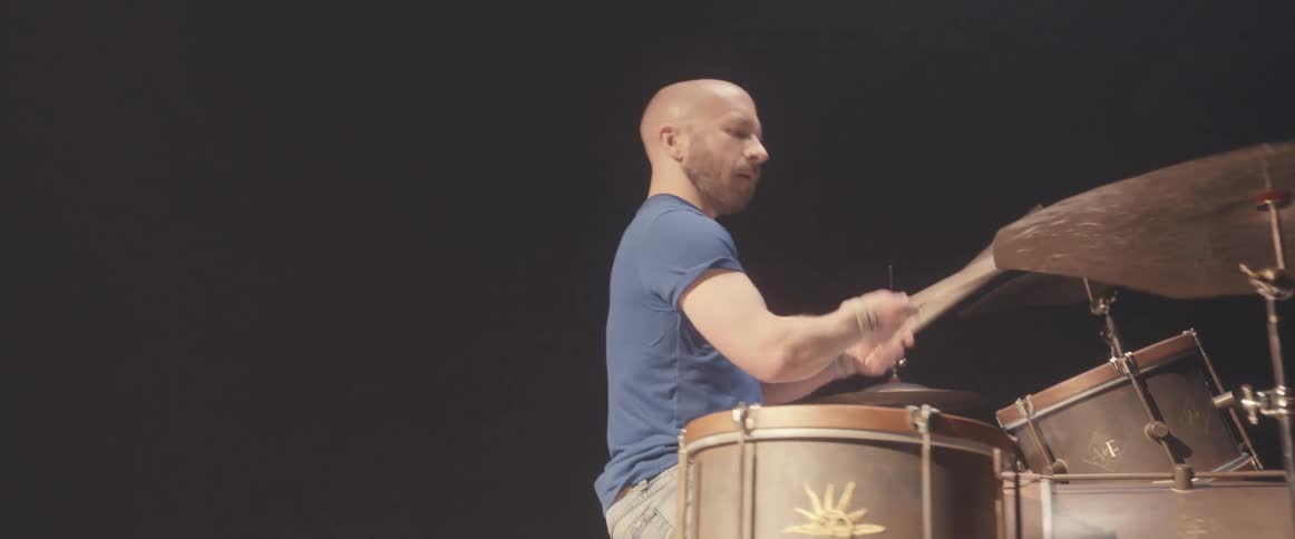 A man is playing the drums