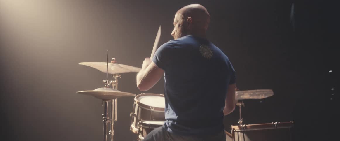 A man is playing the drums