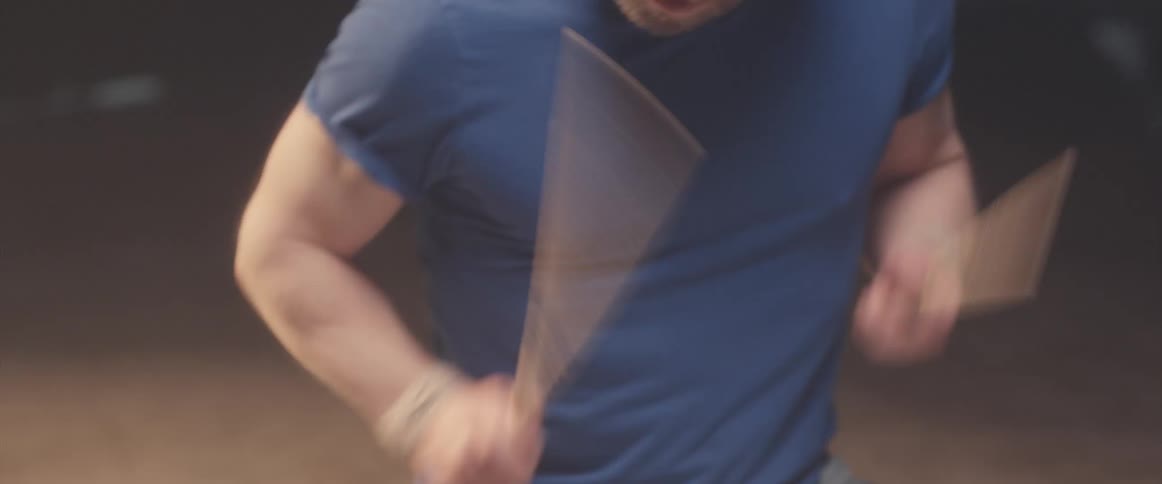 A musician is holding drumsticks and keeping the rhythm playing the drums