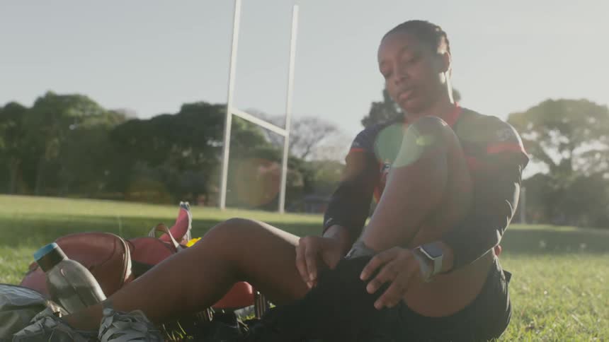 A woman is putting on her socks
