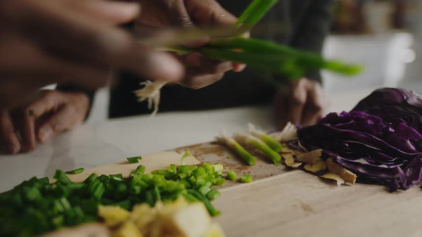 A person is cutting vegetables