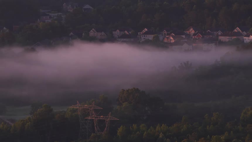 Dense fog settles over a neighborhood