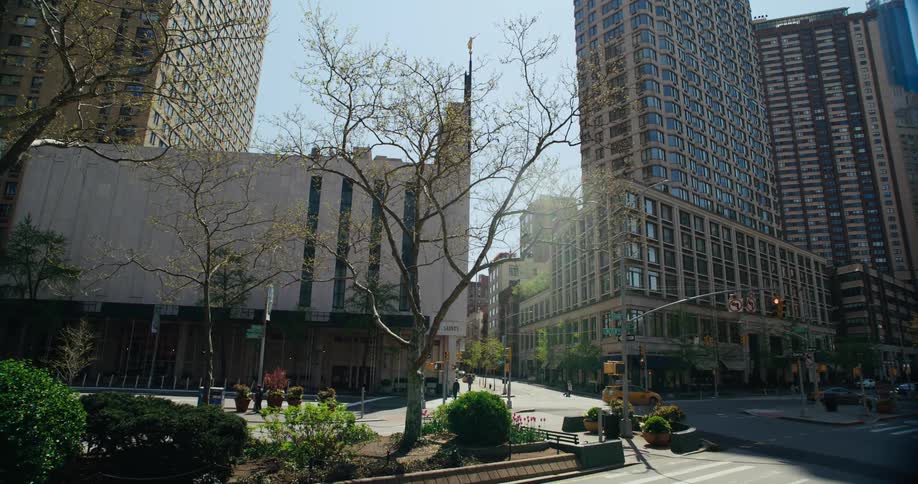 The sun shines down on a city street intersection