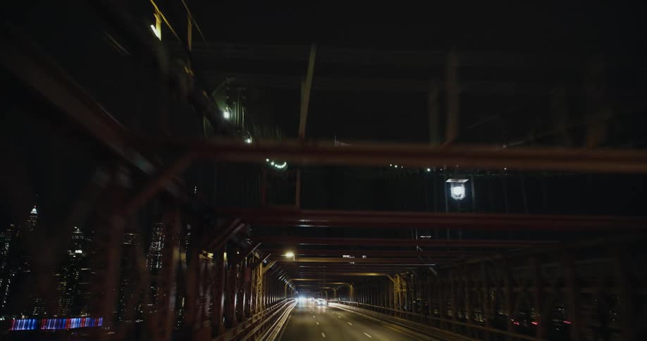 A view of a bridge outdoors at night