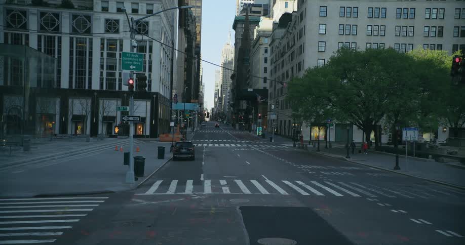A city street is deserted at mid day