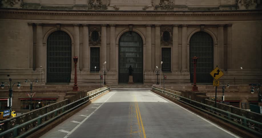 The bridge leads to the large building