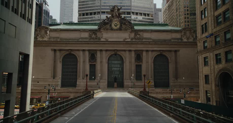 View of a city road with a classic archictecture building visible at a distance