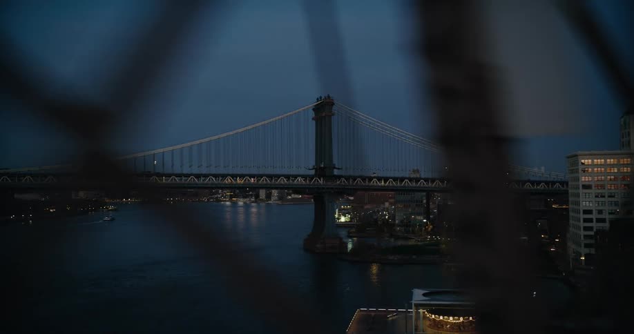 The sun is setting on the bridge