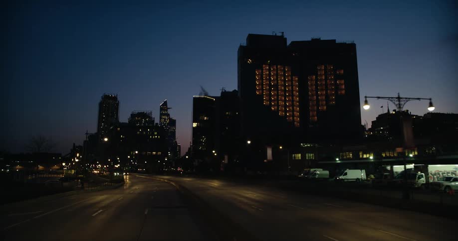 Aerial view of a downtown city at night is displayed