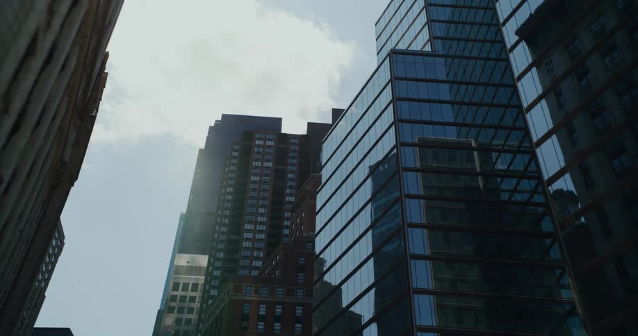Reflections of buildings off the windows of other buildings in a big city