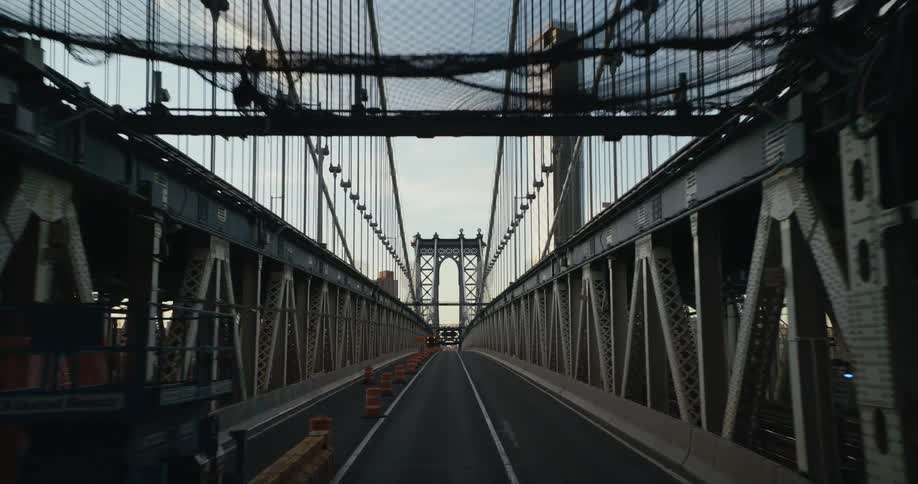 Crossing a suspension bridge with pylons on the side of the tracks