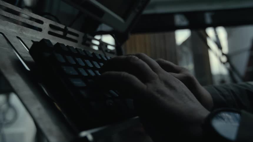 A person types on the keyboard