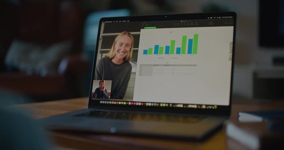 Colleagues discuss a graph during a video call