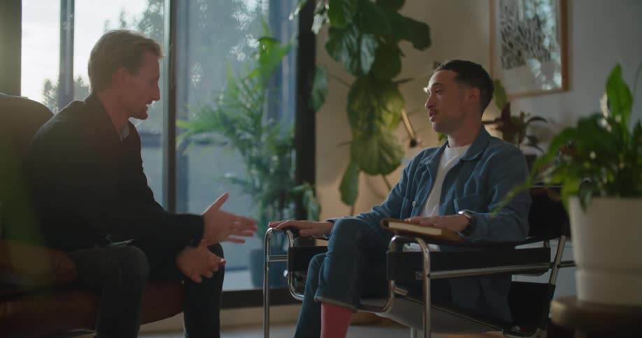 Two men talking in a room
