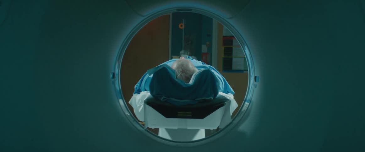 Patient laying on the platform of a magnetic resonance scanner in a hospital