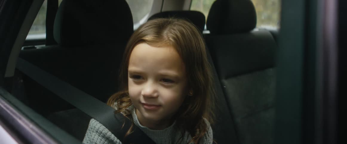 A child is riding in the car