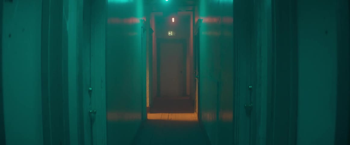 A view of an empty hallway in a house is displayed
